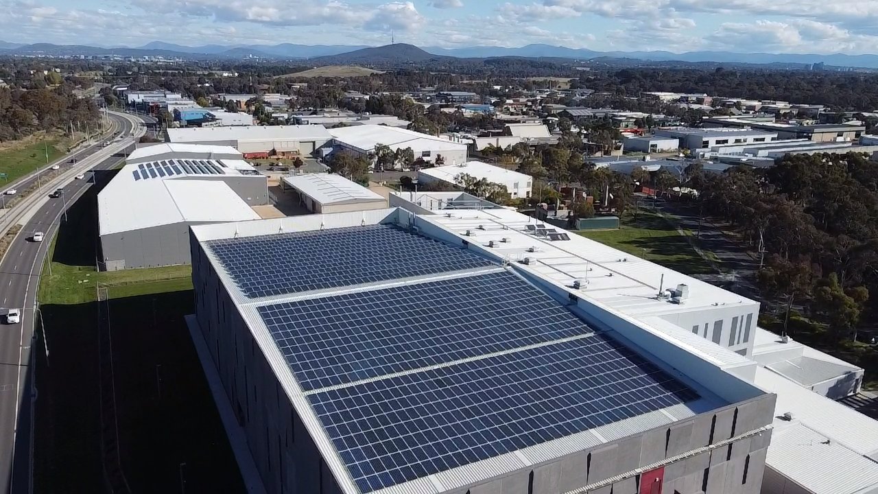 Aerial of Doma hotels and the National Archives rooftop solar arrays in the ACT